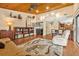 Living room showcasing a wooden ceiling, bookshelves, and a built-in bar at 140 Cowpen Ln, Sarasota, FL 34240
