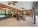 Covered patio with dining area featuring a view of the pool and backyard at 140 Cowpen Ln, Sarasota, FL 34240