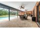 Covered patio featuring an outdoor dining area with a view of the sparkling pool at 140 Cowpen Ln, Sarasota, FL 34240