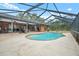 Inviting screened pool with integrated spa, perfect for relaxation and entertaining in your backyard oasis at 140 Cowpen Ln, Sarasota, FL 34240
