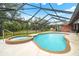 Relaxing screened pool and spa, ideal for unwinding and enjoying the serene outdoor space at 140 Cowpen Ln, Sarasota, FL 34240