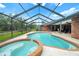 Screened-in pool and spa with outdoor patio area perfect for entertaining or relaxing at 140 Cowpen Ln, Sarasota, FL 34240