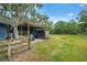 Functional shed with covered area, ideal for storage and outdoor activities at 140 Cowpen Ln, Sarasota, FL 34240