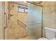 Walk-in shower with glass door, grab bar, and tile surround at 140 Cowpen Ln, Sarasota, FL 34240