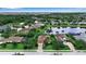 Aerial view of neighborhood featuring well maintained lawns and community pond at 1542 Ormond Ter, Parrish, FL 34219