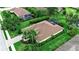 Aerial view showcasing a home with a brick driveway and a screened-in pool at 1542 Ormond Ter, Parrish, FL 34219