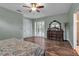 Bedroom featuring wood flooring, a dresser and views to the ensuite bathroom at 1542 Ormond Ter, Parrish, FL 34219