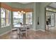 Bright breakfast nook with pool views, chandelier, and tile floors at 1542 Ormond Ter, Parrish, FL 34219