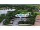 Aerial view of the community pool, clubhouse, and beautiful lake at 1542 Ormond Ter, Parrish, FL 34219