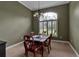 Formal dining area featuring chandelier, neutral walls, and window shutters at 1542 Ormond Ter, Parrish, FL 34219