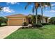 Charming home with a well-manicured lawn, mature landscaping and a brick driveway at 1542 Ormond Ter, Parrish, FL 34219