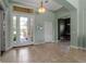 Welcoming foyer with tile flooring, a transom window, and an elegant light fixture at 1542 Ormond Ter, Parrish, FL 34219