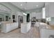 Modern kitchen with white cabinets, stainless steel appliances, and a center island at 1542 Ormond Ter, Parrish, FL 34219