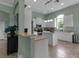 Light and bright kitchen featuring an island, pendant lighting, stainless appliances, and a breakfast bar at 1542 Ormond Ter, Parrish, FL 34219
