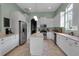 Kitchen with stainless appliances, granite counters, tile floors, and an island for food prep and entertaining at 1542 Ormond Ter, Parrish, FL 34219
