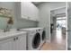 Spacious laundry room featuring LG washer and dryer, and stylish cabinets at 1542 Ormond Ter, Parrish, FL 34219