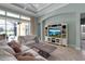 Bright living room with tile floors, a large window, and comfortable seating at 1542 Ormond Ter, Parrish, FL 34219