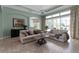 Spacious living room with tile floors, large windows, and comfortable seating at 1542 Ormond Ter, Parrish, FL 34219