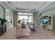 Inviting living room with tile floors, large windows, and comfortable seating at 1542 Ormond Ter, Parrish, FL 34219