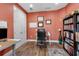 Intimate office featuring wood floors, a cozy rug and storage at 1542 Ormond Ter, Parrish, FL 34219