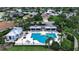 Community pool with lounge chairs and cabanas, perfect for relaxing and enjoying the Florida sunshine at 1542 Ormond Ter, Parrish, FL 34219