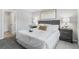 Cozy bedroom featuring a tufted headboard, plush bedding, and neutral decor at 155 Swift St, Port Charlotte, FL 33954