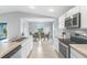 Contemporary kitchen features stainless steel appliances and adjacent dining area at 155 Swift St, Port Charlotte, FL 33954
