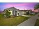 View of home showcasing well-kept lawn and proximity to other residences at 16746 Parker River St, Wimauma, FL 33598