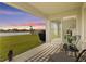 Covered patio offering a view of the expansive backyard, perfect for relaxing outdoors at 16746 Parker River St, Wimauma, FL 33598