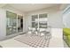 Outdoor patio with comfortable seating and a serene view overlooking the backyard at 16746 Parker River St, Wimauma, FL 33598