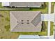 Aerial close-up of roof highlighting new roof and landscaping at 16746 Parker River St, Wimauma, FL 33598