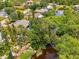 The aerial view highlights the home's private patio and mature landscaping, offering a peaceful retreat at 1715 Fossil Dr, Englewood, FL 34223