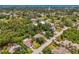 Panoramic aerial view of the neighborhood showcasing lush greenery, nearby waterways, and serene residential streets at 1715 Fossil Dr, Englewood, FL 34223