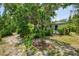 Secluded backyard with verdant landscaping providing privacy and tranquility at 1715 Fossil Dr, Englewood, FL 34223