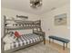 Nautical themed bedroom features a bunk bed, a window, and modern decor at 1715 Fossil Dr, Englewood, FL 34223