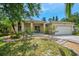 Beautiful single-Gathering home with well-manicured landscaping, a two-car garage, and a cozy front porch at 1715 Fossil Dr, Englewood, FL 34223