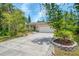 Inviting single-Gathering home featuring a two-car garage, stone accents and well-maintained landscaping at 1715 Fossil Dr, Englewood, FL 34223