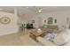 Open concept living space with modern furnishings and a view into the dining area at 1715 Fossil Dr, Englewood, FL 34223