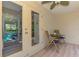 Covered patio featuring outdoor seating and view to the screened in Lanai at 1715 Fossil Dr, Englewood, FL 34223