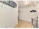 A spacious walk-in closet with laminate floors, a ceiling light, and wire shelving at 1715 Fossil Dr, Englewood, FL 34223
