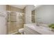 Updated bathroom featuring a glass-enclosed shower and a white vanity with a stone countertop at 203 28Th W St, Palmetto, FL 34221