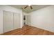 Bedroom featuring hardwood floors, a closet, and access to another room, providing versatility and space at 203 28Th W St, Palmetto, FL 34221