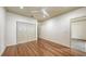 Spacious bedroom featuring a ceiling fan, hardwood floors, and a closet for ample storage at 203 28Th W St, Palmetto, FL 34221