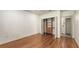 Bedroom with hardwood floors, a closet with organizers, and access to an en-suite bathroom at 203 28Th W St, Palmetto, FL 34221