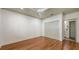 Bright bedroom with wood floors, double closet doors and an en suite bathroom at 203 28Th W St, Palmetto, FL 34221