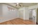 Bright bedroom with hardwood floors, ceiling fan, closet and natural light at 203 28Th W St, Palmetto, FL 34221