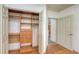 Spacious walk-in closet with built-in shelving and drawers, adjacent to another room at 203 28Th W St, Palmetto, FL 34221