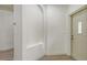 Bright foyer features hard surface floors, a neutral color palette and an arched display niche at 203 28Th W St, Palmetto, FL 34221