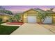 Charming home featuring a well-manicured lawn, lovely landscaping and an attached two car garage at 203 28Th W St, Palmetto, FL 34221