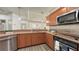 The well-equipped kitchen features stone countertops and stainless steel appliances at 203 28Th W St, Palmetto, FL 34221